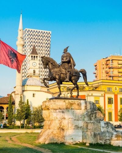 large_skanderbeg-square-with-flag-skanderbeg-monument-and-the-et-hem-bey-mosque-in-the-center-of-tirana-city-albania-AdobeStock_126268393.jpg_71a6eb77a8.jpg